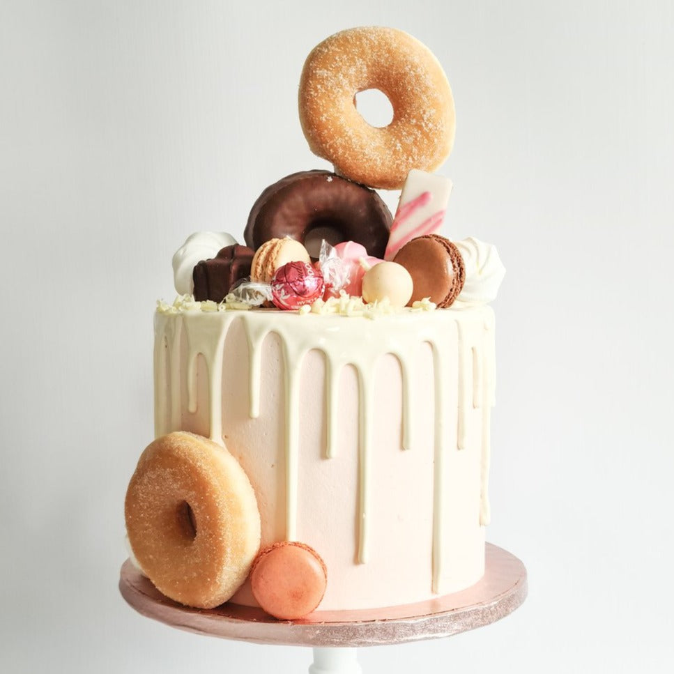 Gorgeous pink doughnut drip birthday or celebration cake on the Isle of Man