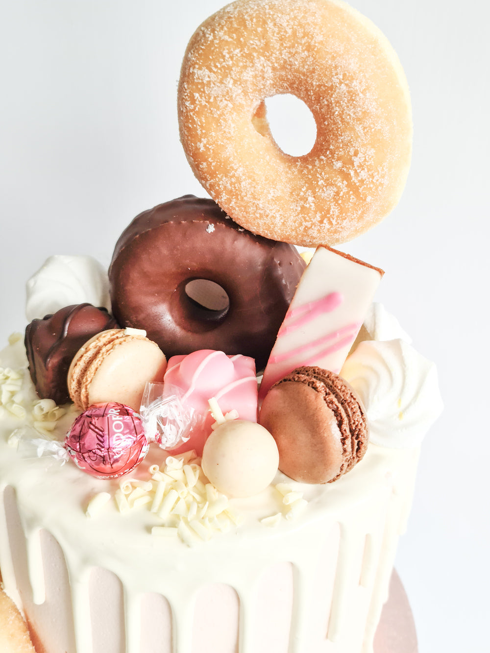 Gorgeous pink doughnut drip birthday or celebration cake on the Isle of Man