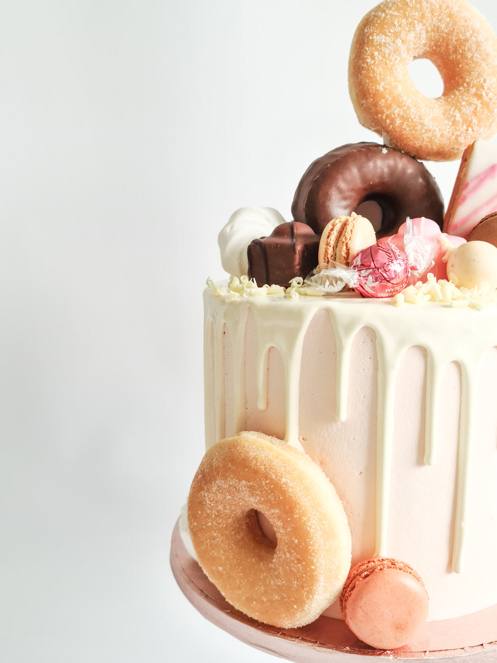 Gorgeous pink doughnut drip birthday or celebration cake on the Isle of Man
