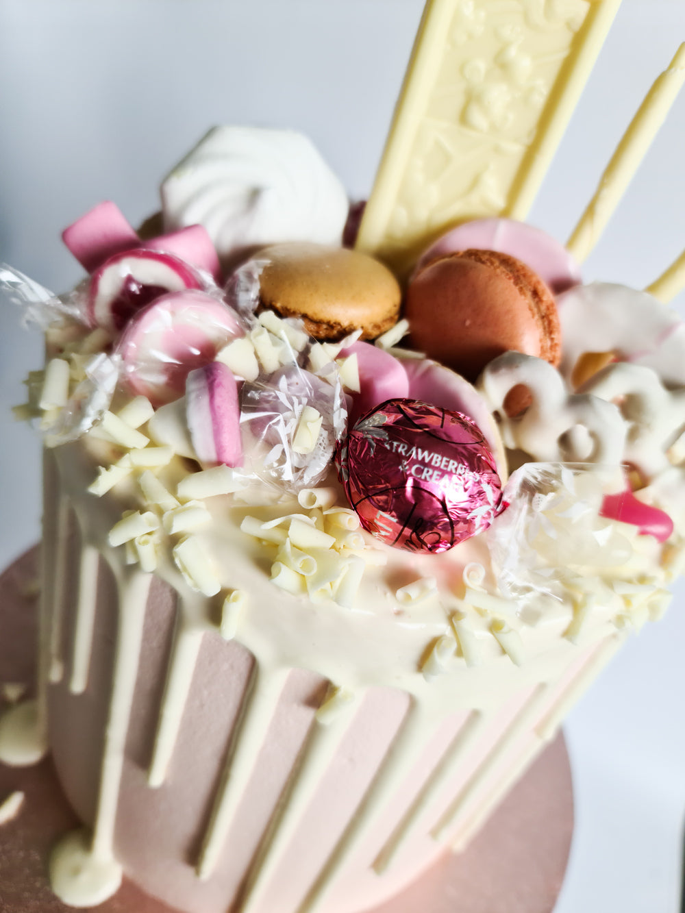 Pink fully loaded drip birthday celebration cake Isle of Man
