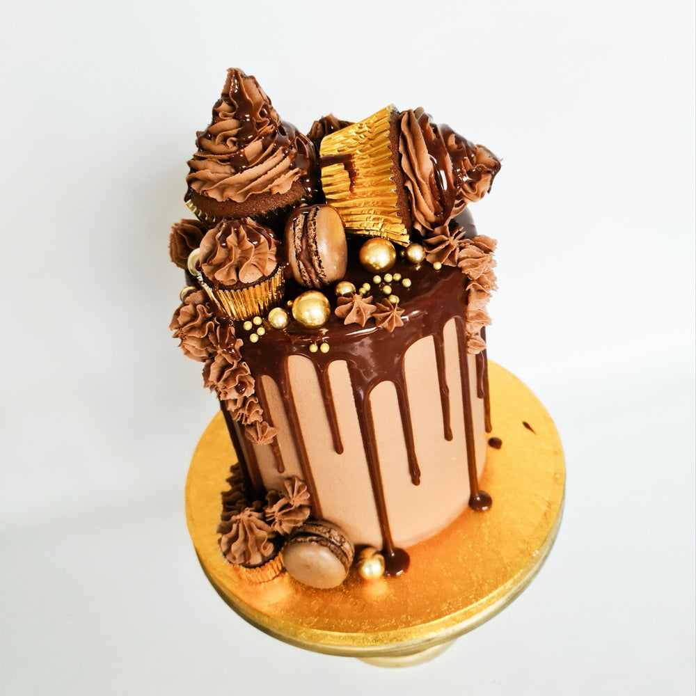Chocolate cupcakes and macaron drip birthday celebration cake Isle of Man