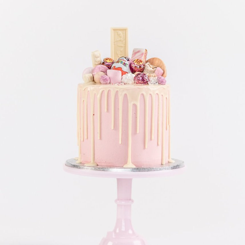 Pink fully loaded drip birthday celebration cake Isle of Man