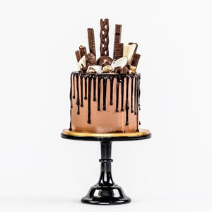 Chocolate fully loaded drip cake for birthday celebration Isle of Man